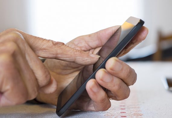 Senior woman Using mobile phone at home