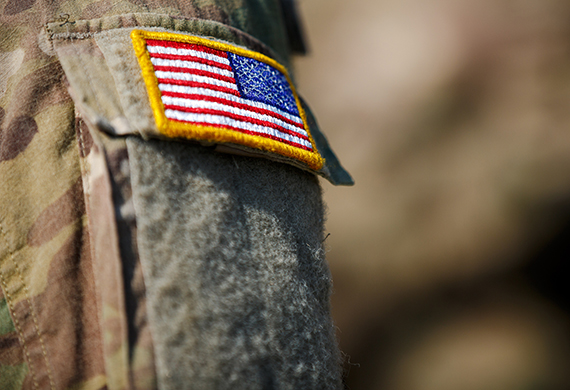USA flag and US Army patch on solder's uniform