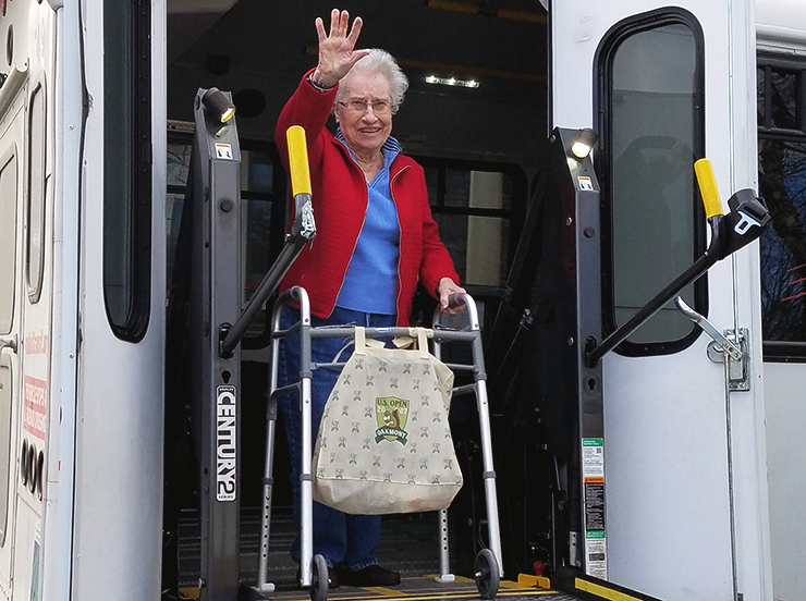 woman-with-mobility-device exiting a bus