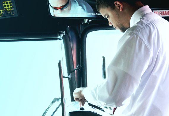 rider paying fare on express bus