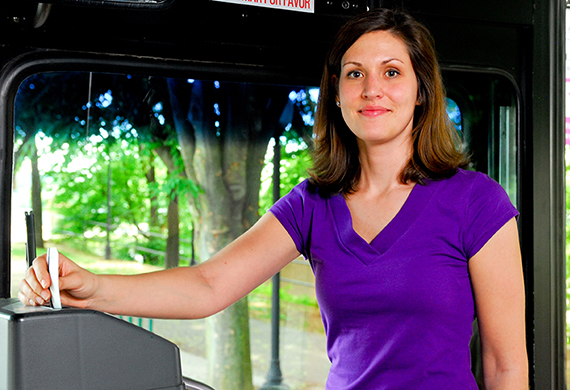 woman putting bus pass in machine
